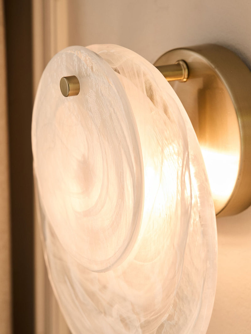 White Claremont wall light with brushed brass and opaque glass discs, imported from the UK