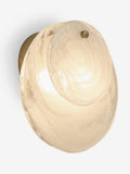 White Claremont wall light with brushed brass and opaque glass discs, imported from the UK