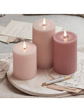 Lights4fun pink LED pillar candle trio with varying heights, UK version