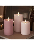 Lights4fun pink LED pillar candle trio with varying heights, UK version