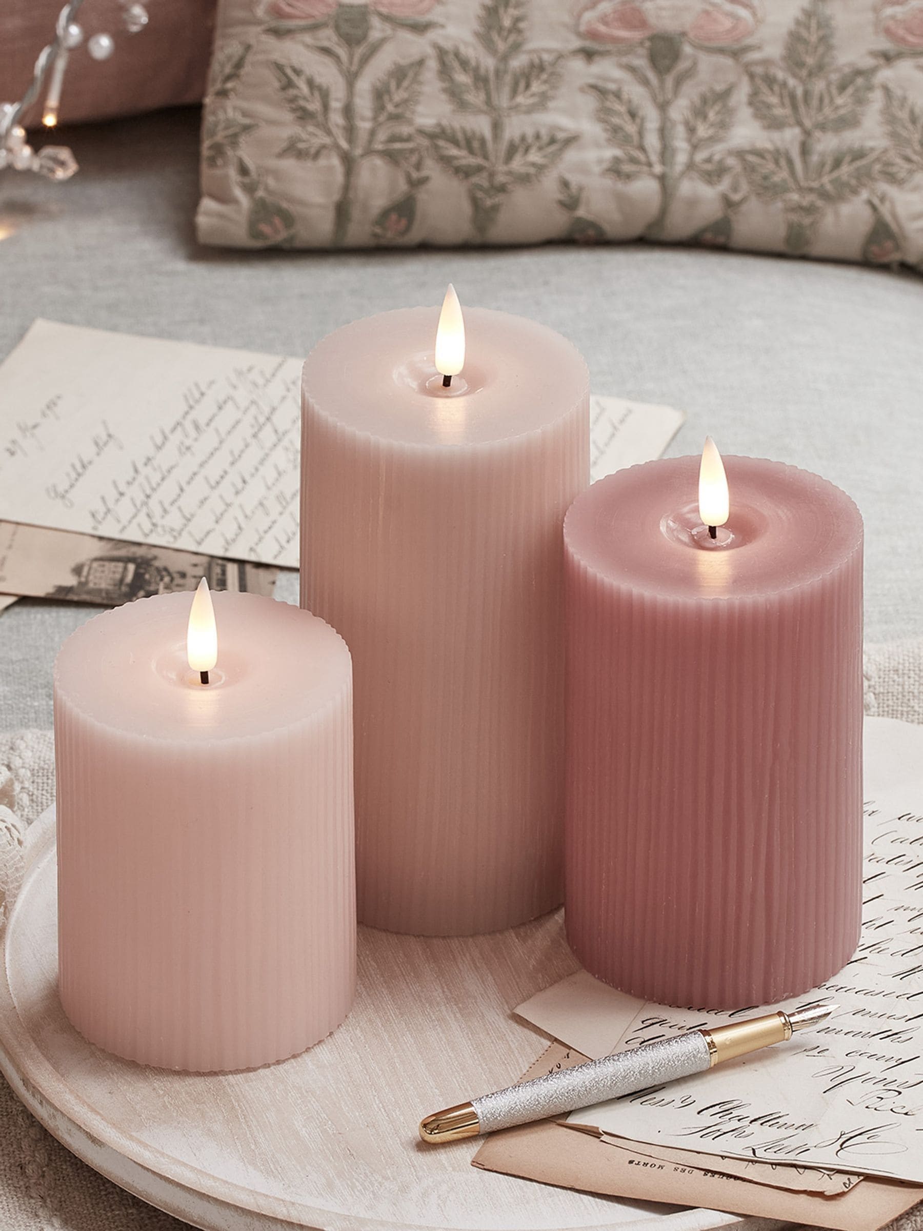 Lights4fun pink LED pillar candle trio with varying heights, UK version
