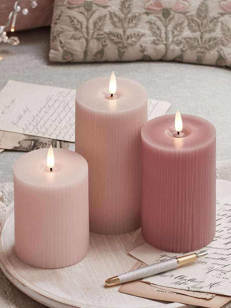 Lights4fun pink LED pillar candle trio with varying heights, UK version
