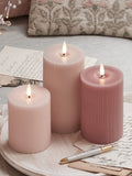 Lights4fun pink LED pillar candle trio with varying heights, UK version