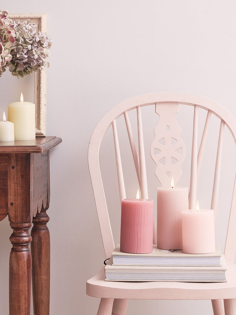 Lights4fun pink LED pillar candle trio with varying heights, UK version