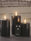 Lights4fun black TruGlow LED pillar candle trio with 15cm, 12.5cm, and 10cm heights, UK version