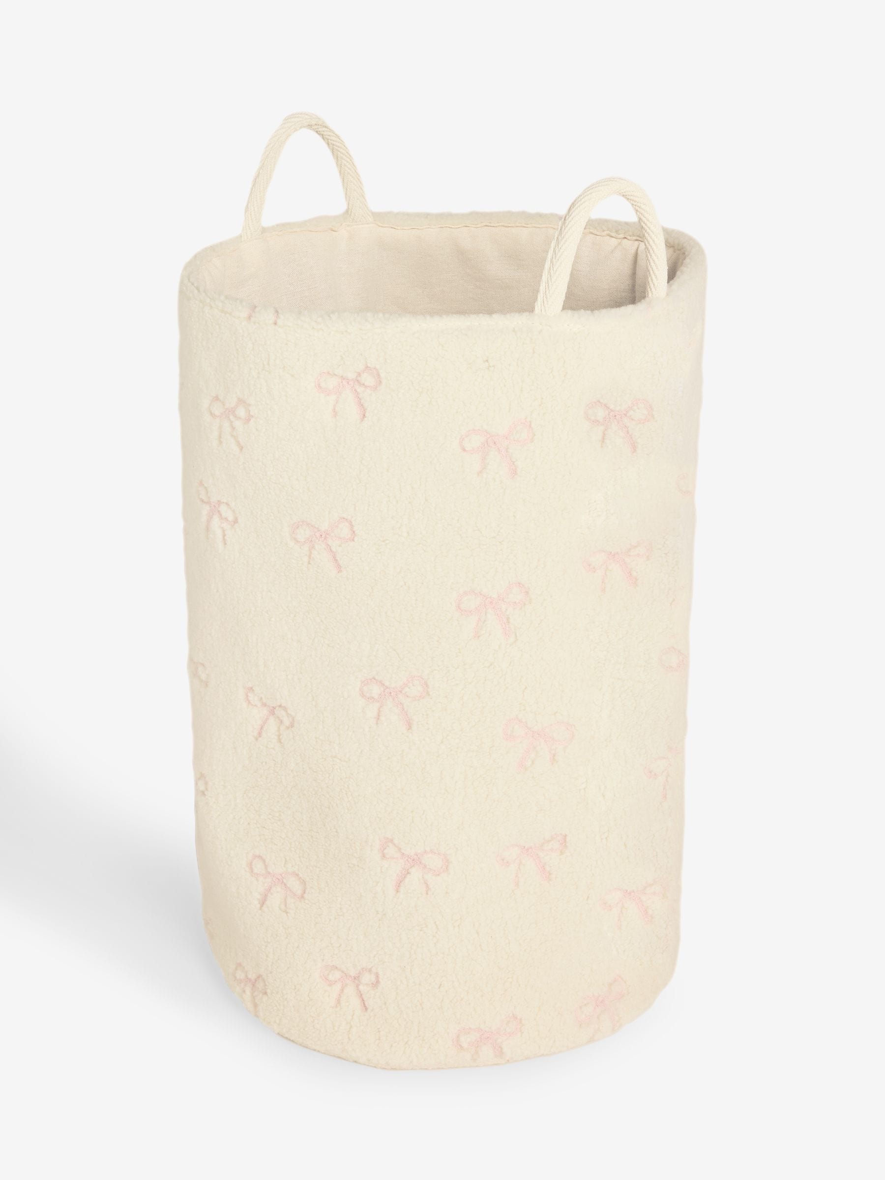 Cream bow laundry hamper with embroidered bows, imported from the UK