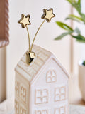Kremfarget keramisk vinterhusornament