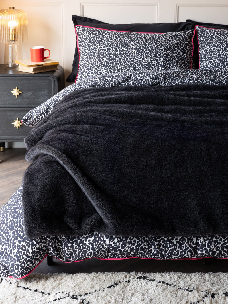 Rockett St George black luxe faux fur slogan throw British brand