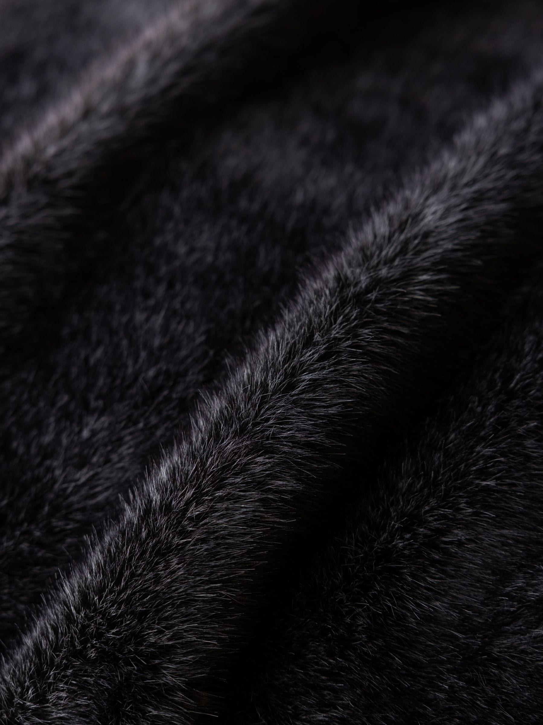 Rockett St George black luxe faux fur slogan throw British brand