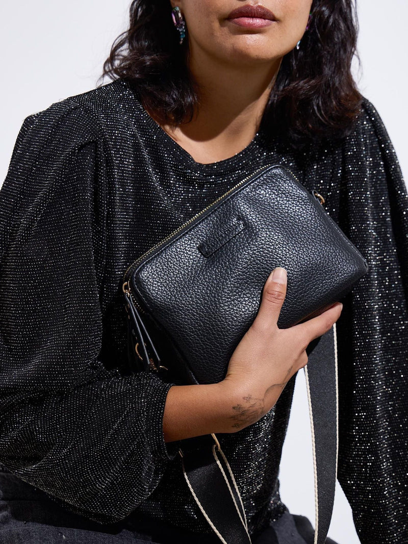 Oliver Bonas black Laura slim cross-body bag, imported from the UK