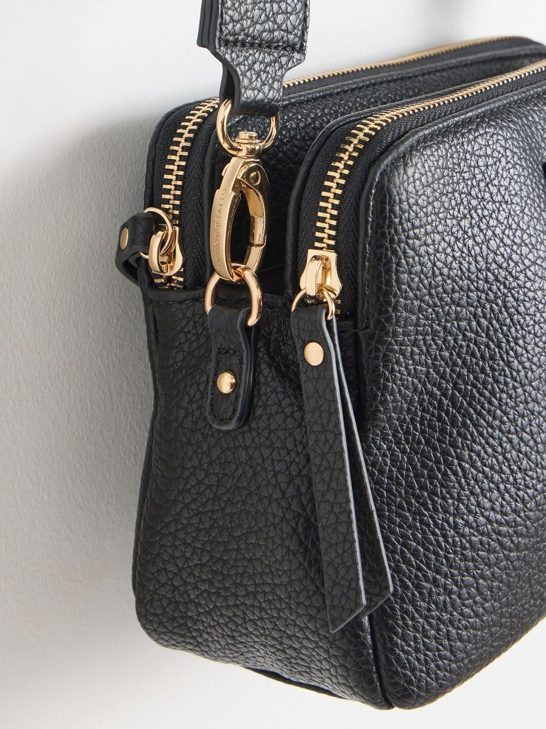 Oliver Bonas black Laura slim cross-body bag, imported from the UK
