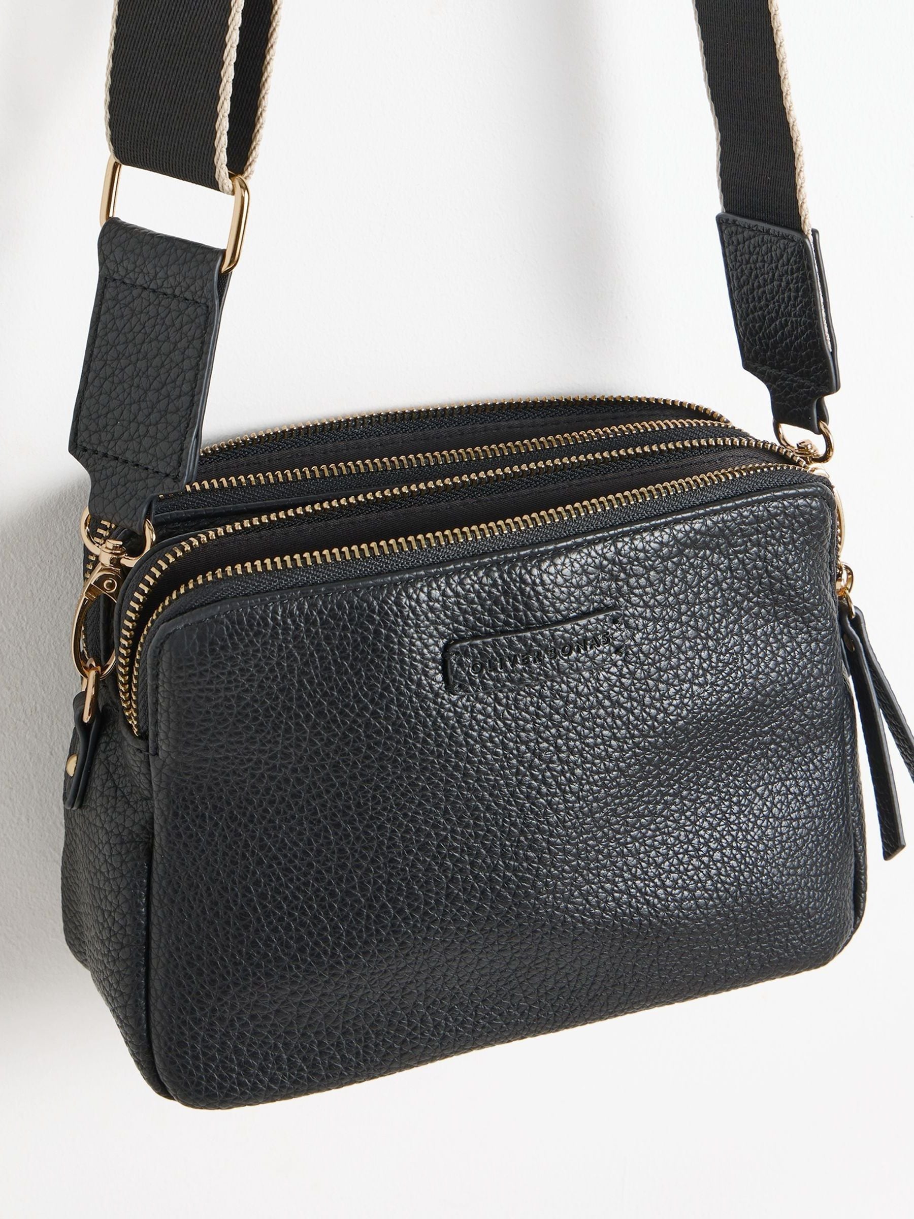 Oliver Bonas black Laura slim cross-body bag, imported from the UK