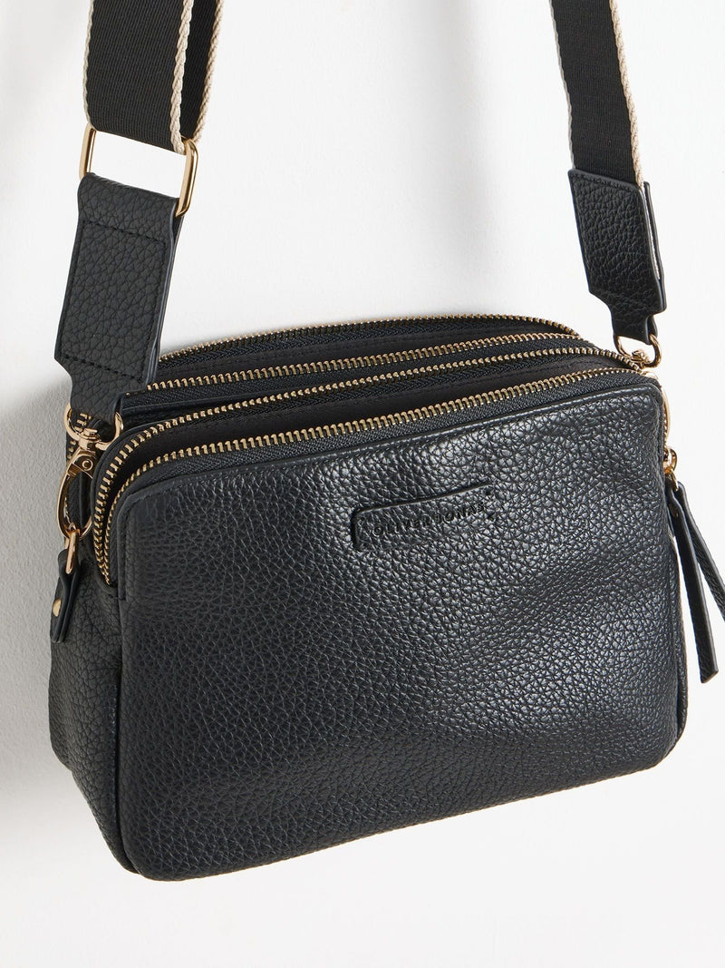 Oliver Bonas black Laura slim cross-body bag, imported from the UK