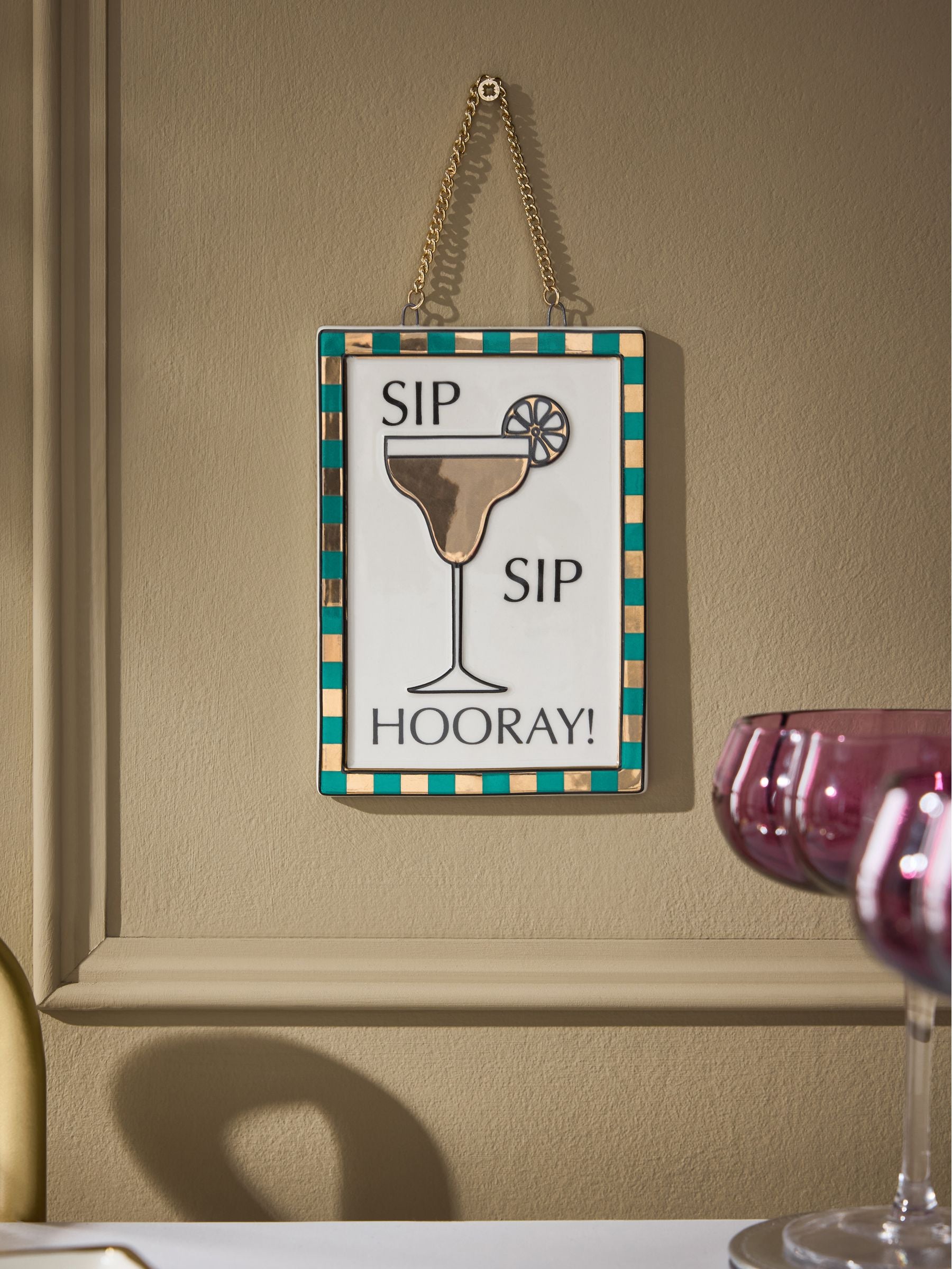 Gold ceramic Sip Sip Hooray hanging decoration (British brand)