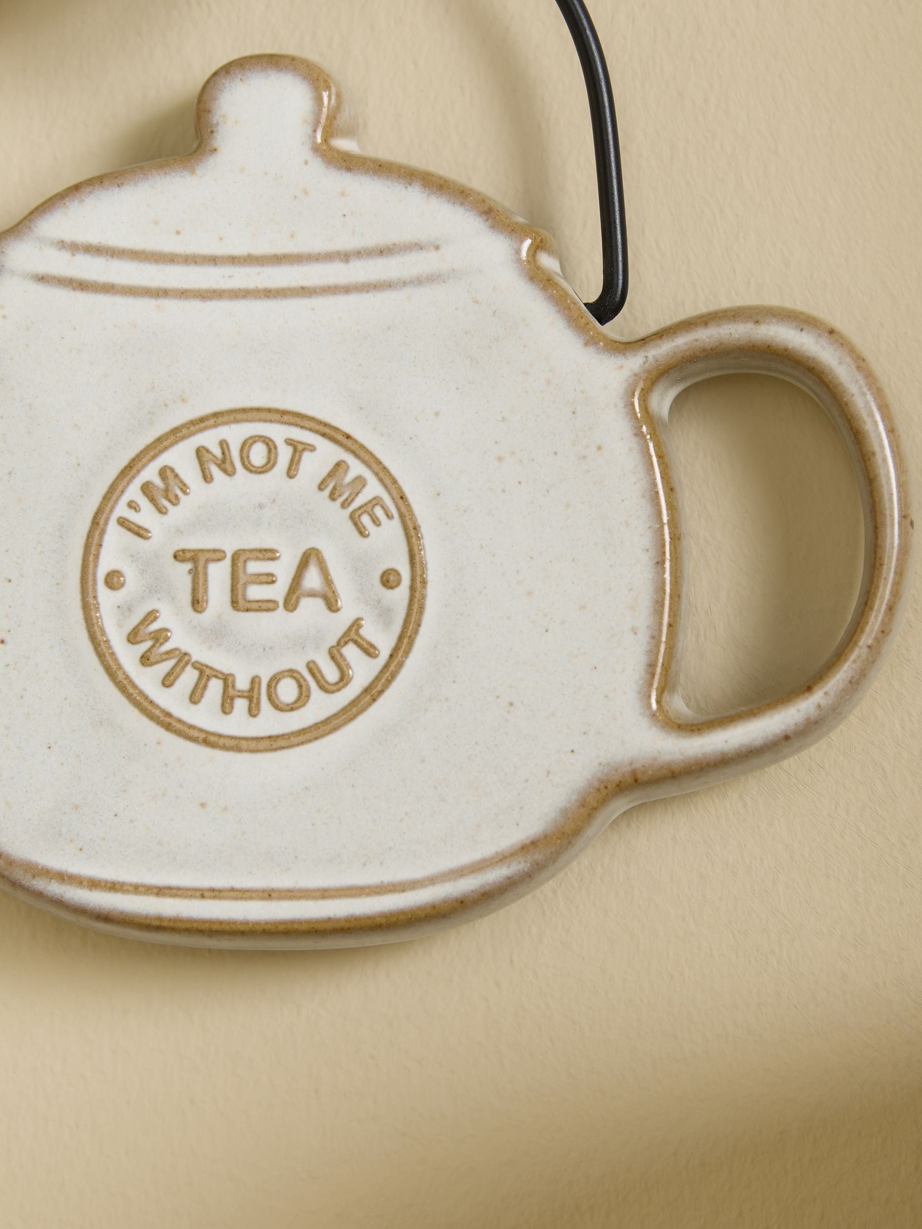 Grey ceramic Not Me Without Tea hanging decoration (British brand)