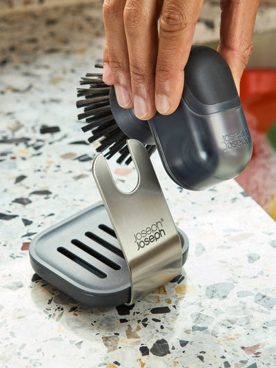 Next Joseph Joseph Clear SinkTech Soap-Dispensing Palm Brush with Stand- Buy online at McGrocer