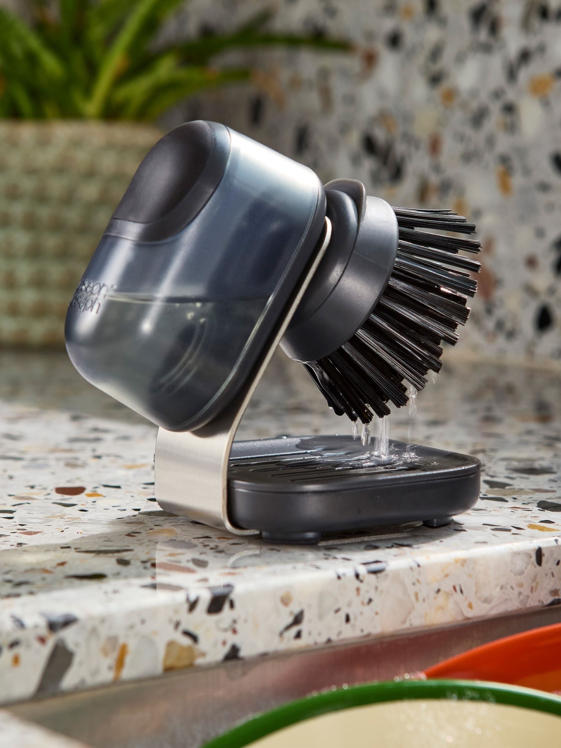 Joseph Joseph soap-dispensing palm brush with stand (British brand)