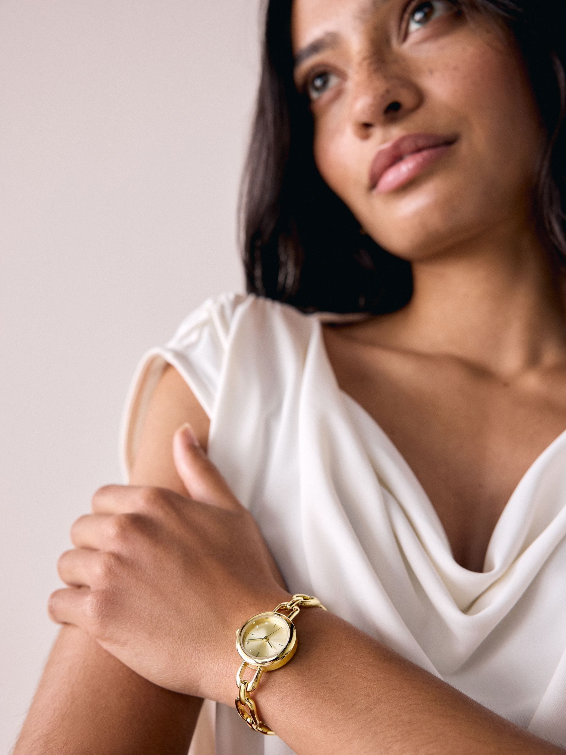 Gold tone round dial bracelet watch, imported from the UK