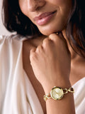 Gold tone round dial bracelet watch, imported from the UK