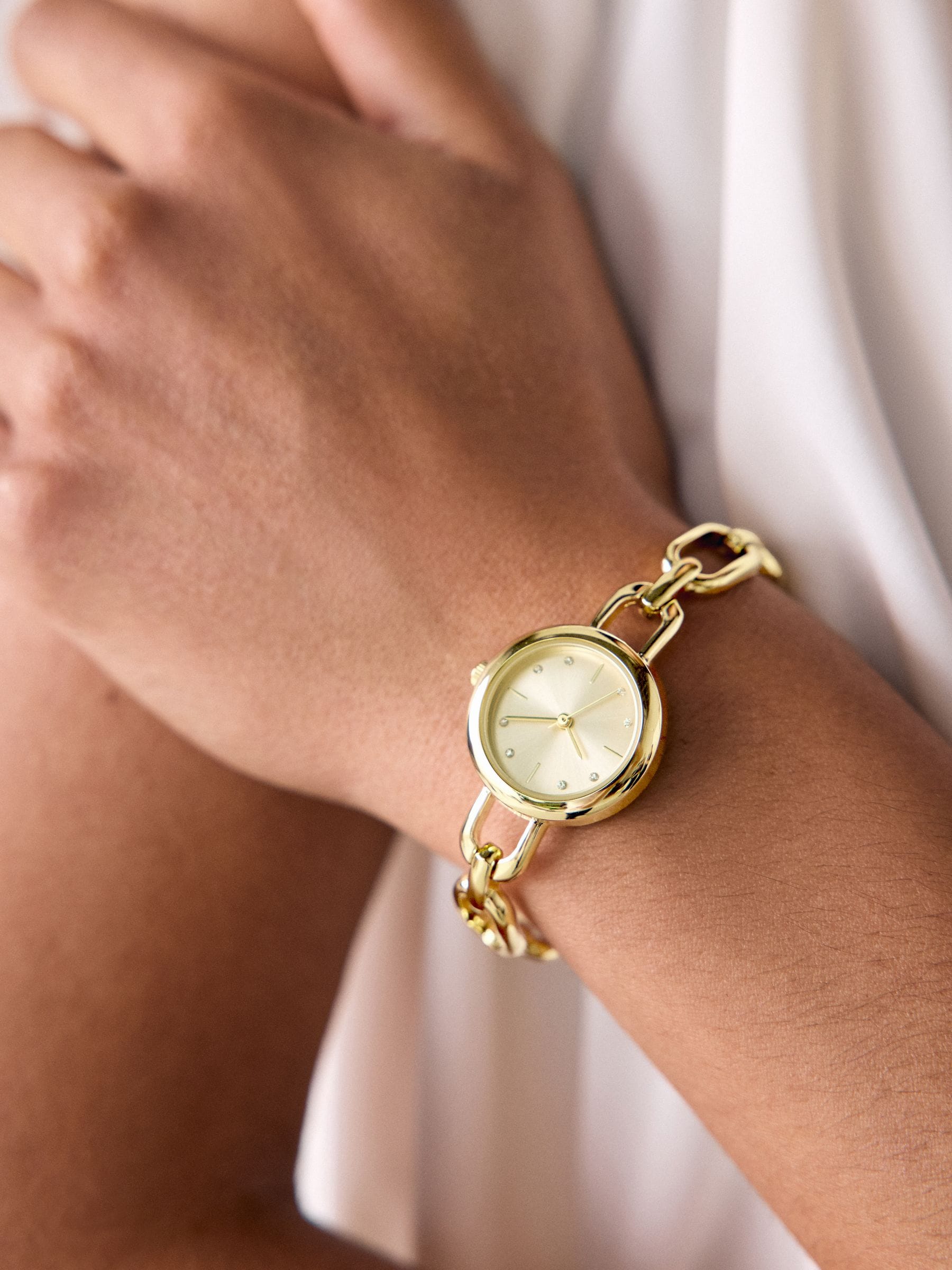 Gold tone round dial bracelet watch, imported from the UK