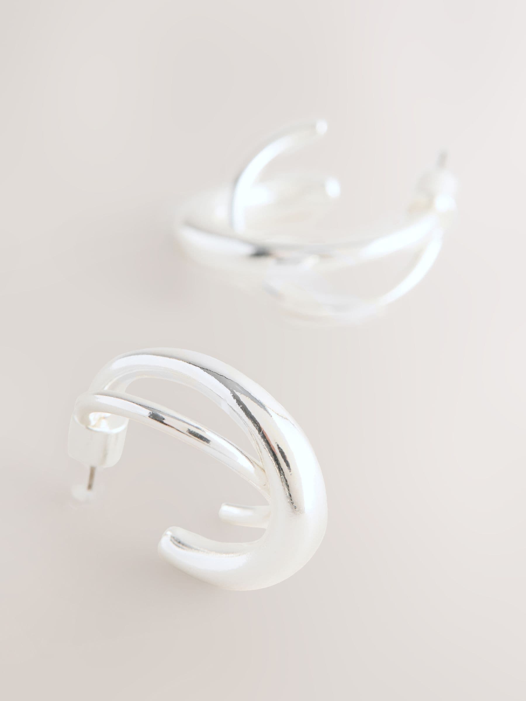 Silver tone crossover hoop earrings (British brand)