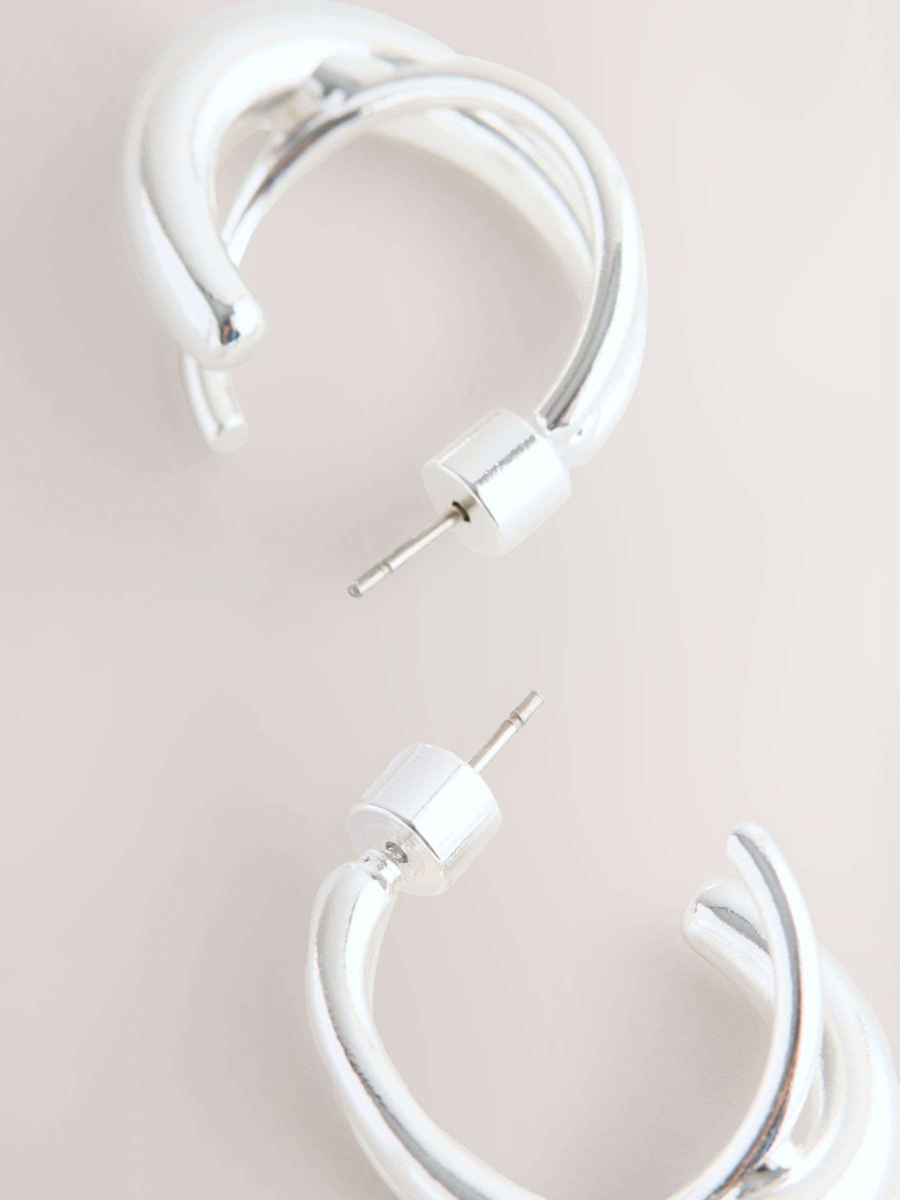 Silver tone crossover hoop earrings (British brand)