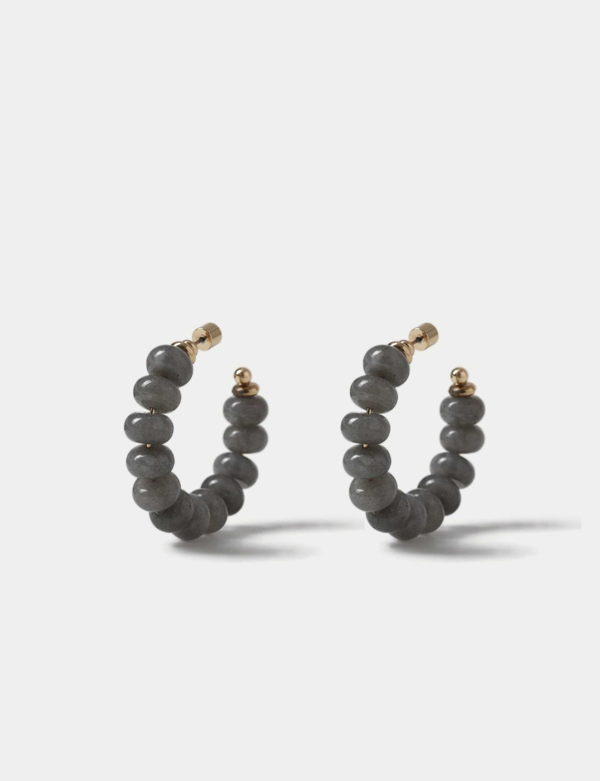 Faceted natural stone hoop earrings with iron accents, imported from the UK