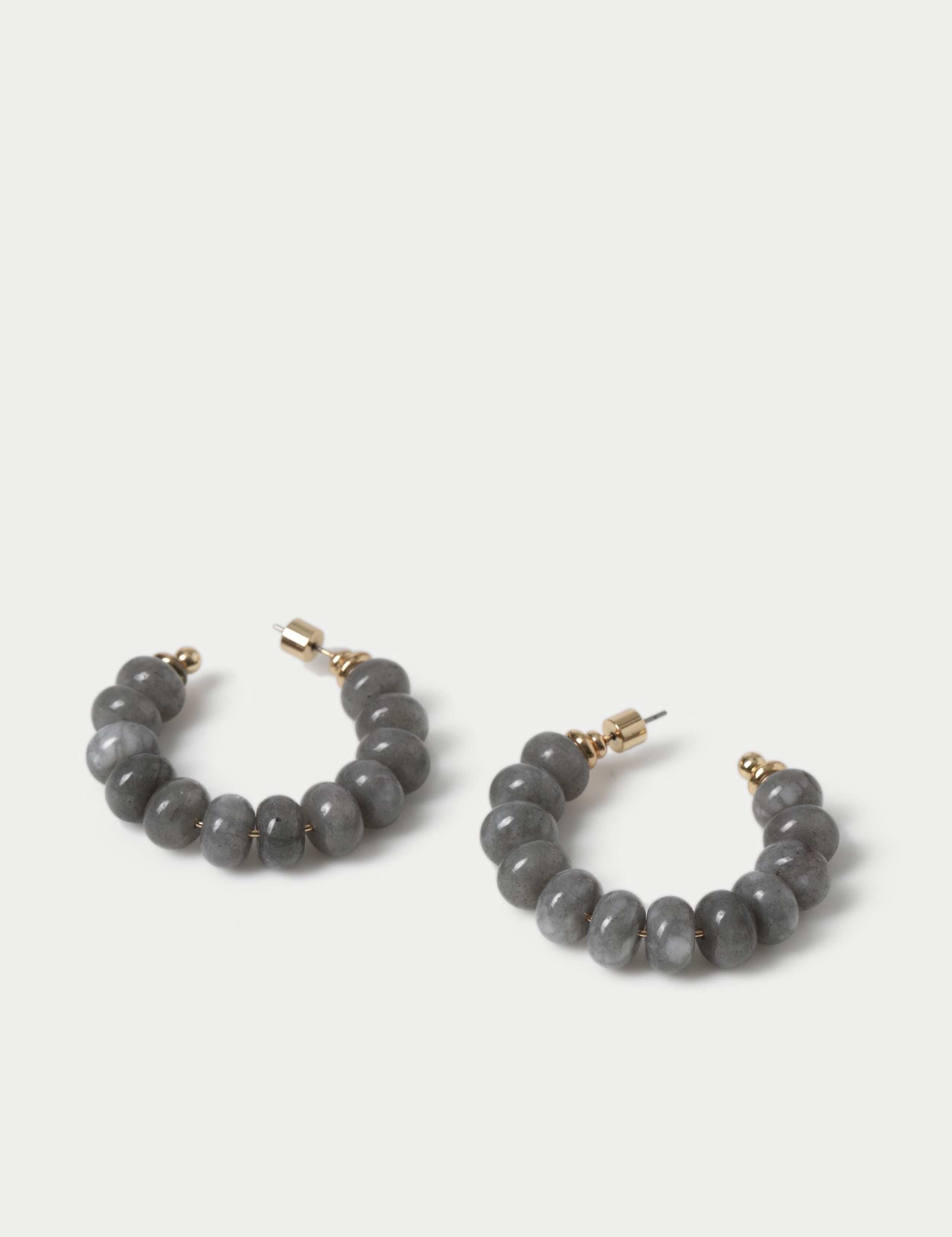 Faceted natural stone hoop earrings with iron accents, imported from the UK