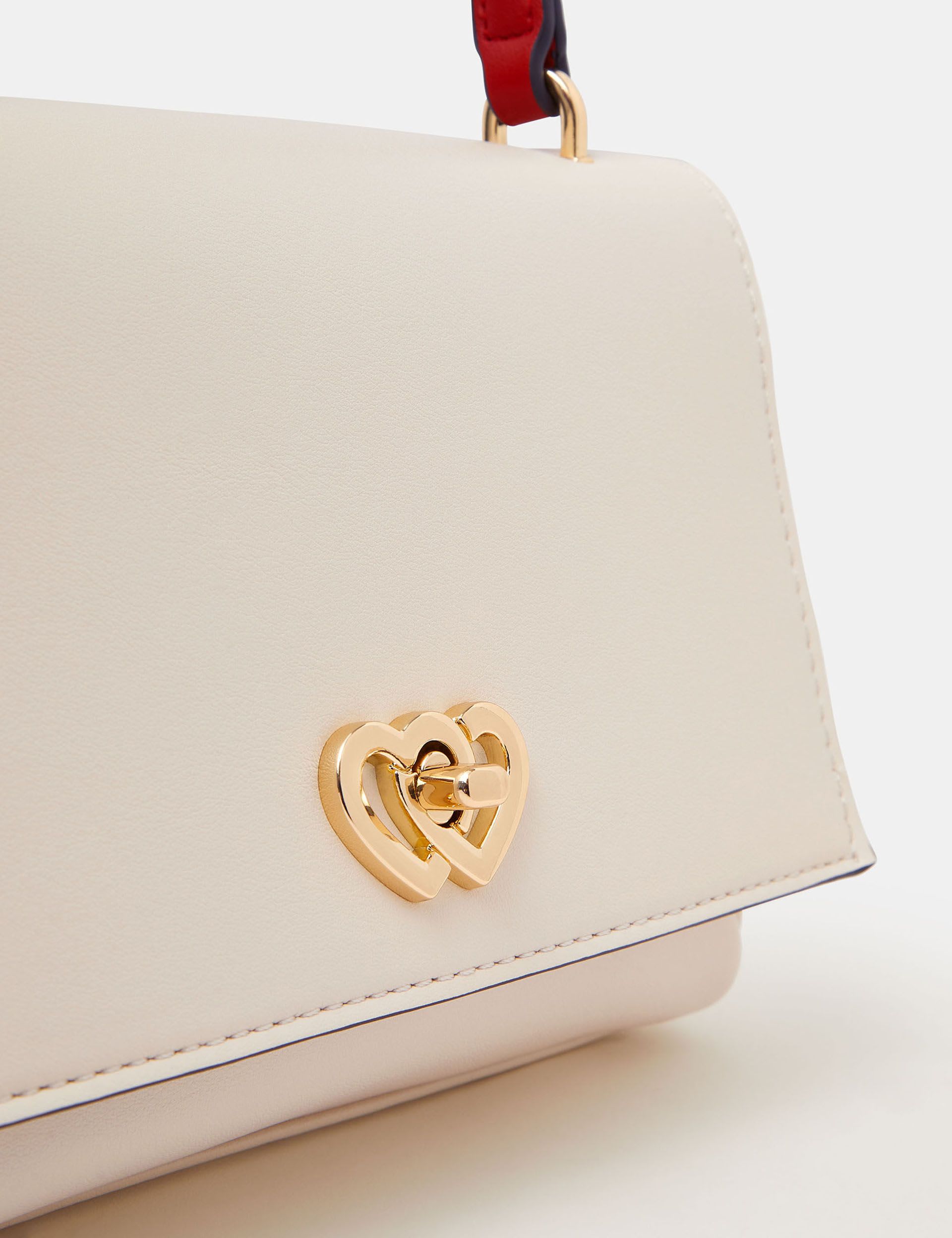 Accessorize faux leather heart clasp cross body bag, UK version