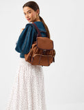 Accessorize faux suede backpack with gold hardware, imported from the UK