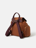 Accessorize faux suede backpack with gold hardware, imported from the UK