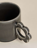 Stoneware mug with a flower-shaped handle - British product