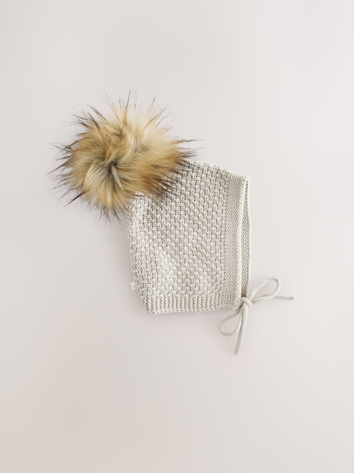 The Little Tailor baby hat with pom pom, UK version