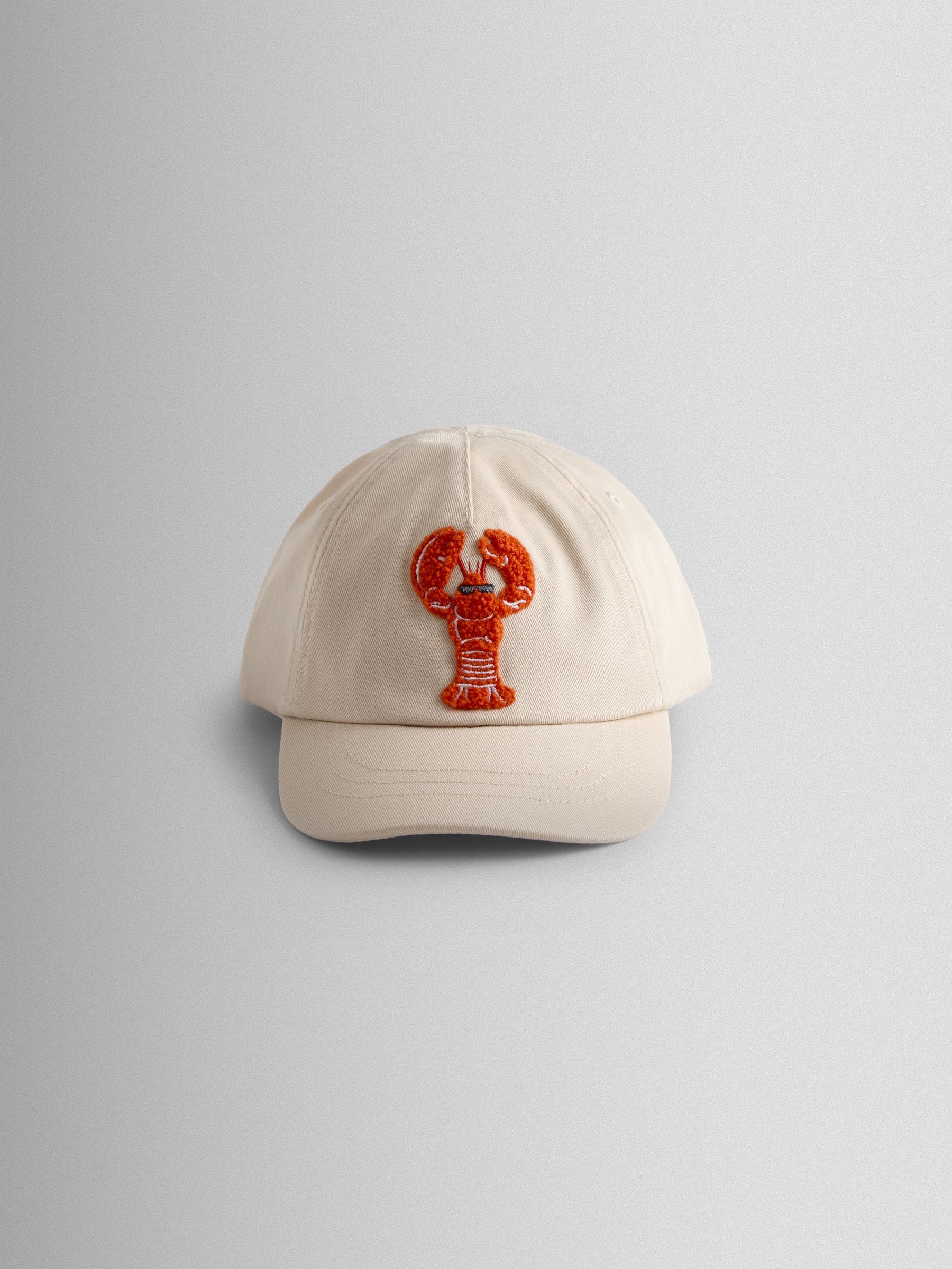 JoJo Maman Bébé ecru lobster bouclé cap, imported from the UK