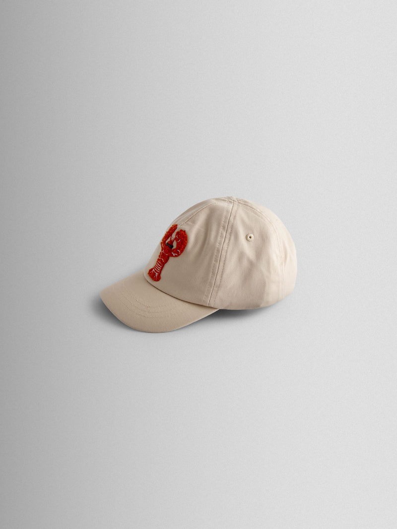 JoJo Maman Bébé ecru lobster bouclé cap, imported from the UK