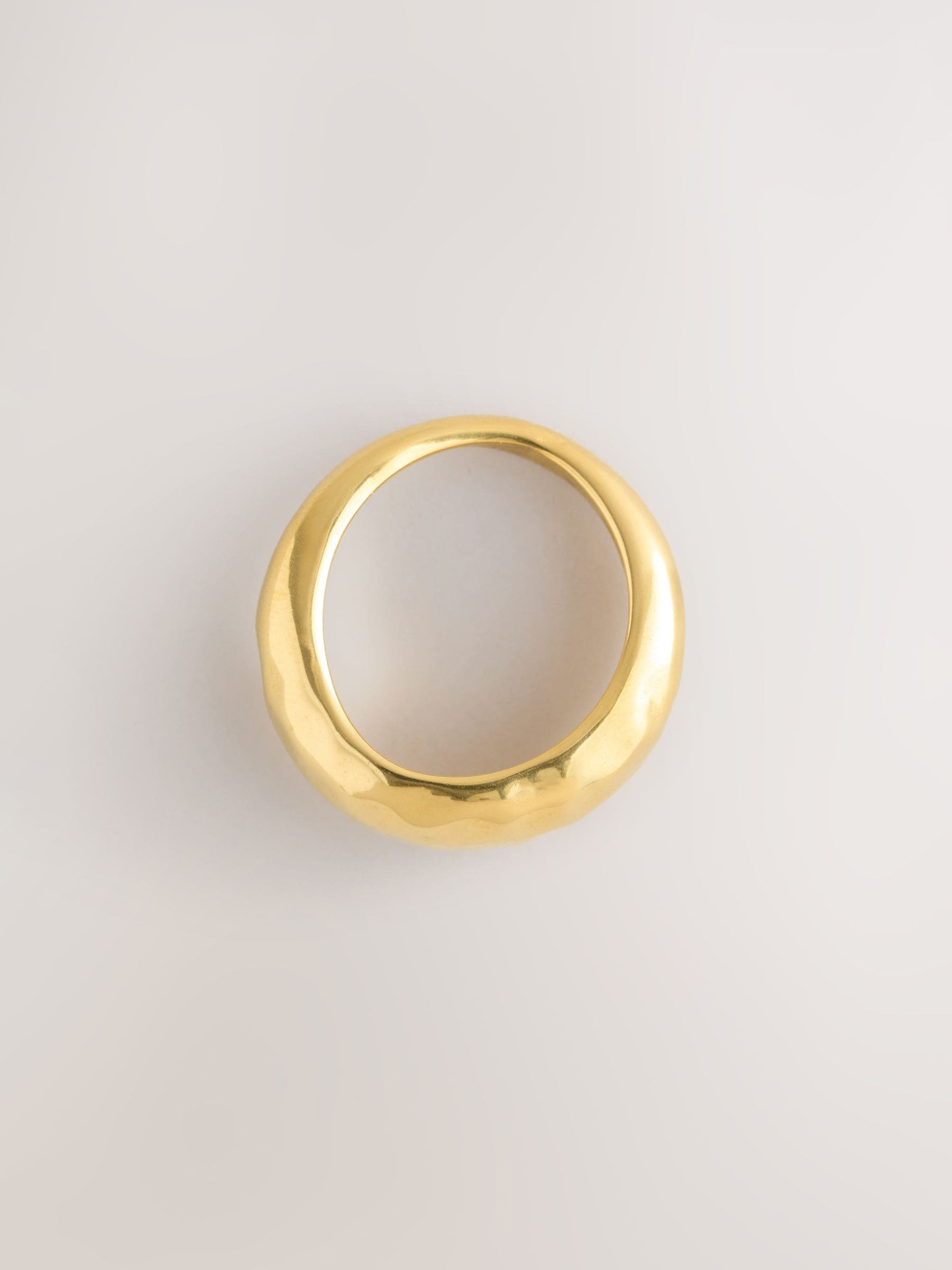 Gold tone stainless steel waterproof domed ring, imported from the UK