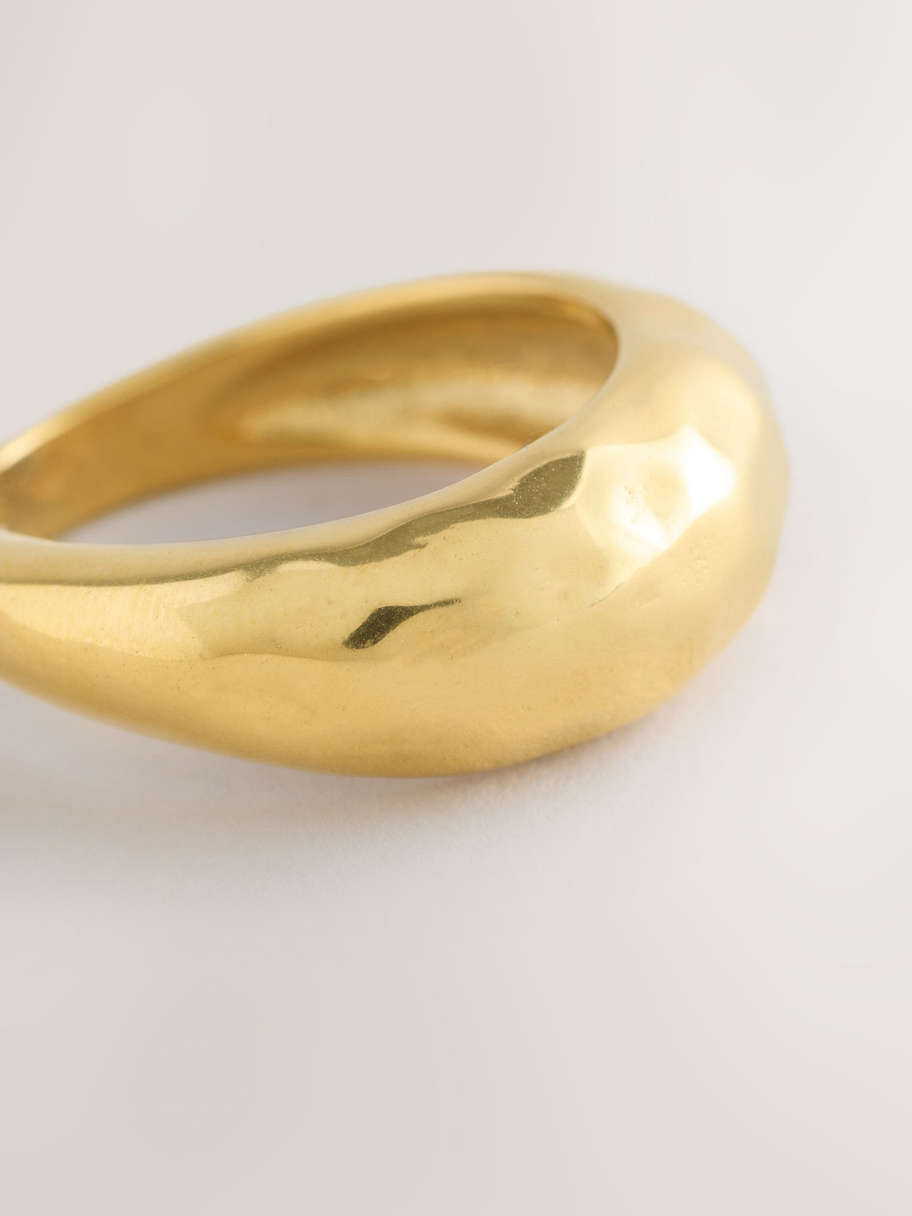 Gold tone stainless steel waterproof domed ring, imported from the UK