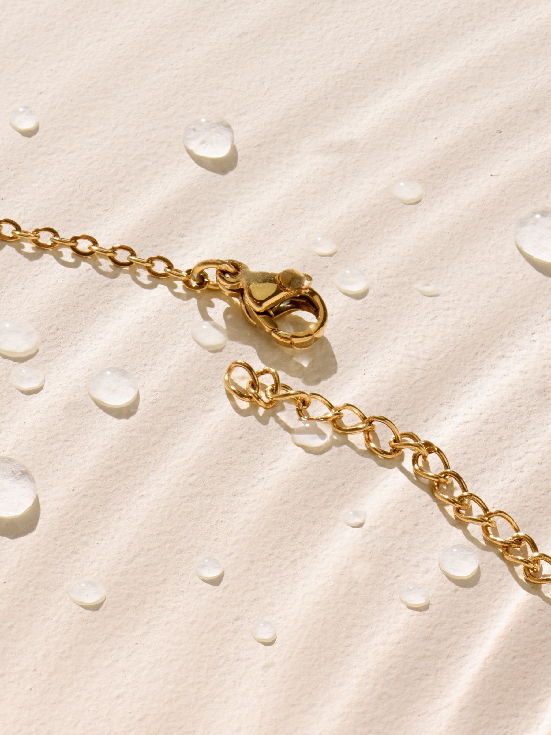 Gold tone waterproof stainless steel pebble necklace, UK version