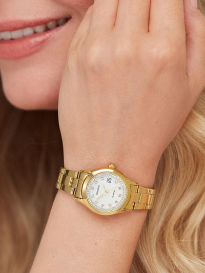 Montre analogique ronde dorée pour femme avec cadran nacre et lunette sertie de pierres, boîtier 27 mm