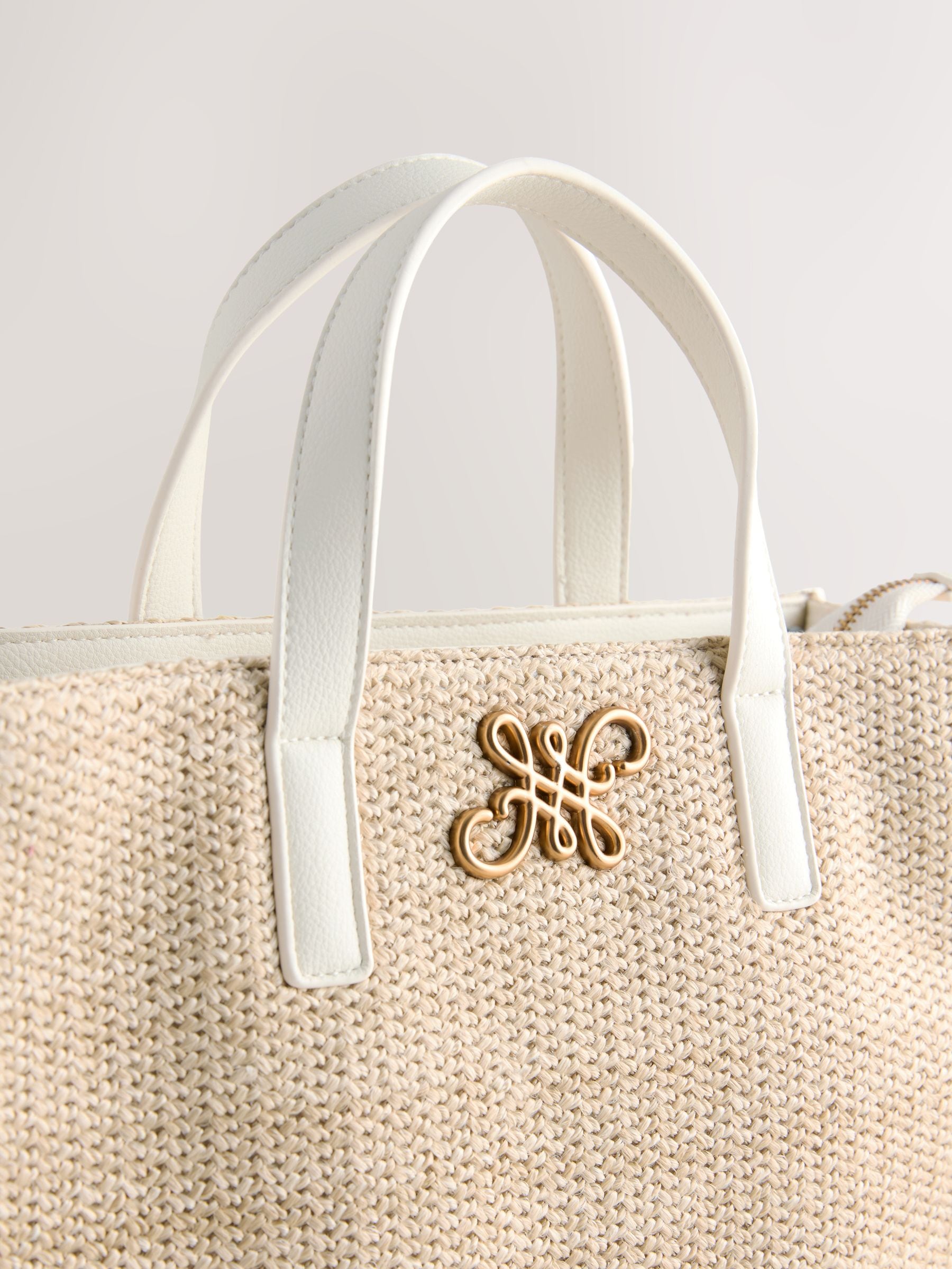 Raffia effect shoulder bag with recycled polyester lining (British brand)