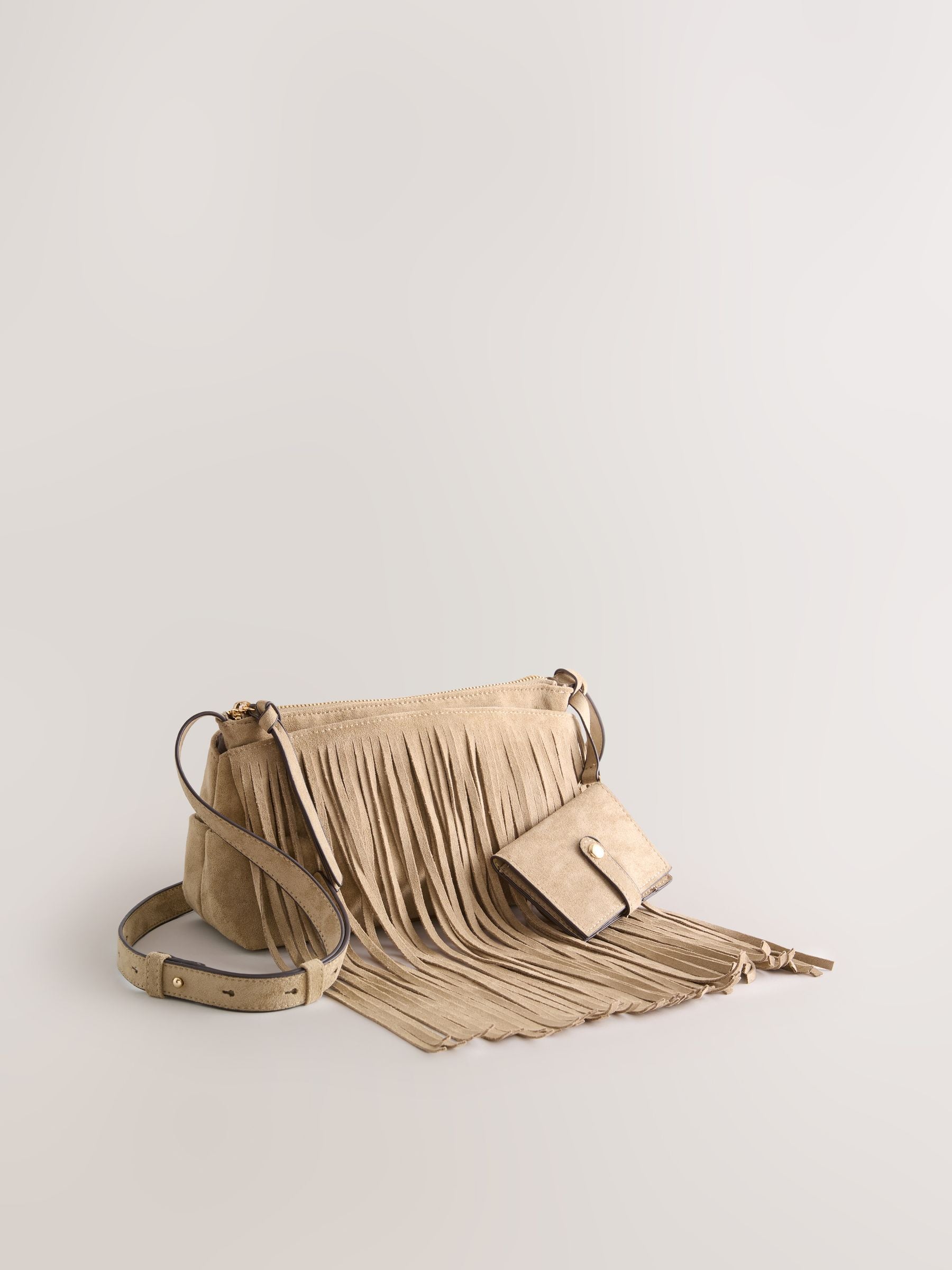 Stone suedette cross-body bag with fringe detail (British brand)