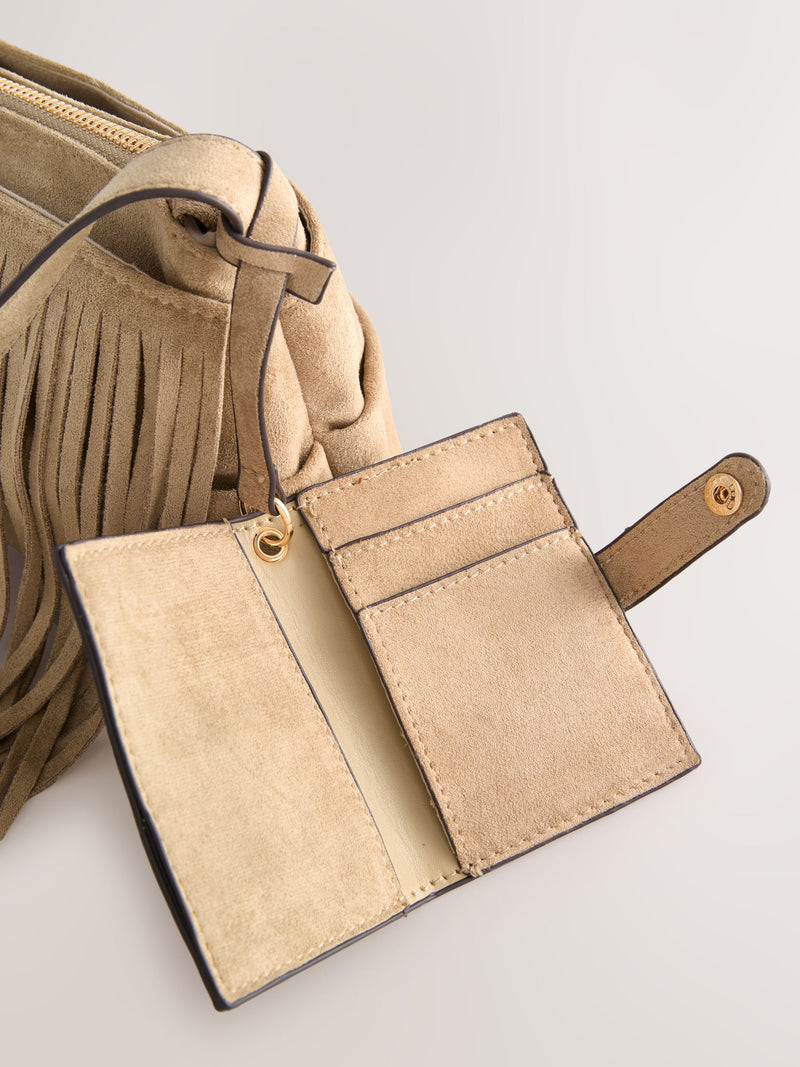 Stone suedette cross-body bag with fringe detail (British brand)