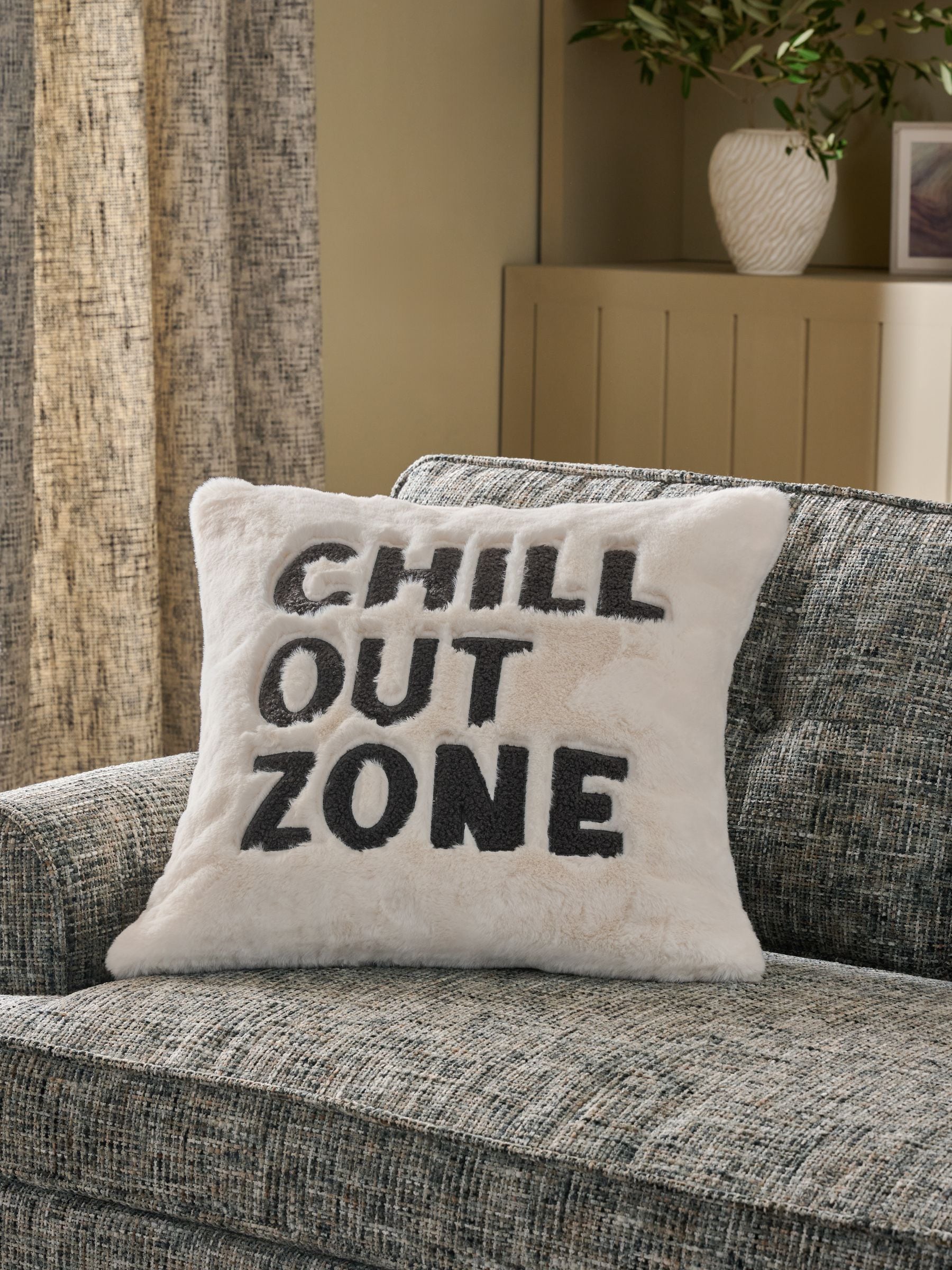 Faux fur cushion with Chill Out Zone slogan 50x50cm, imported from the UK