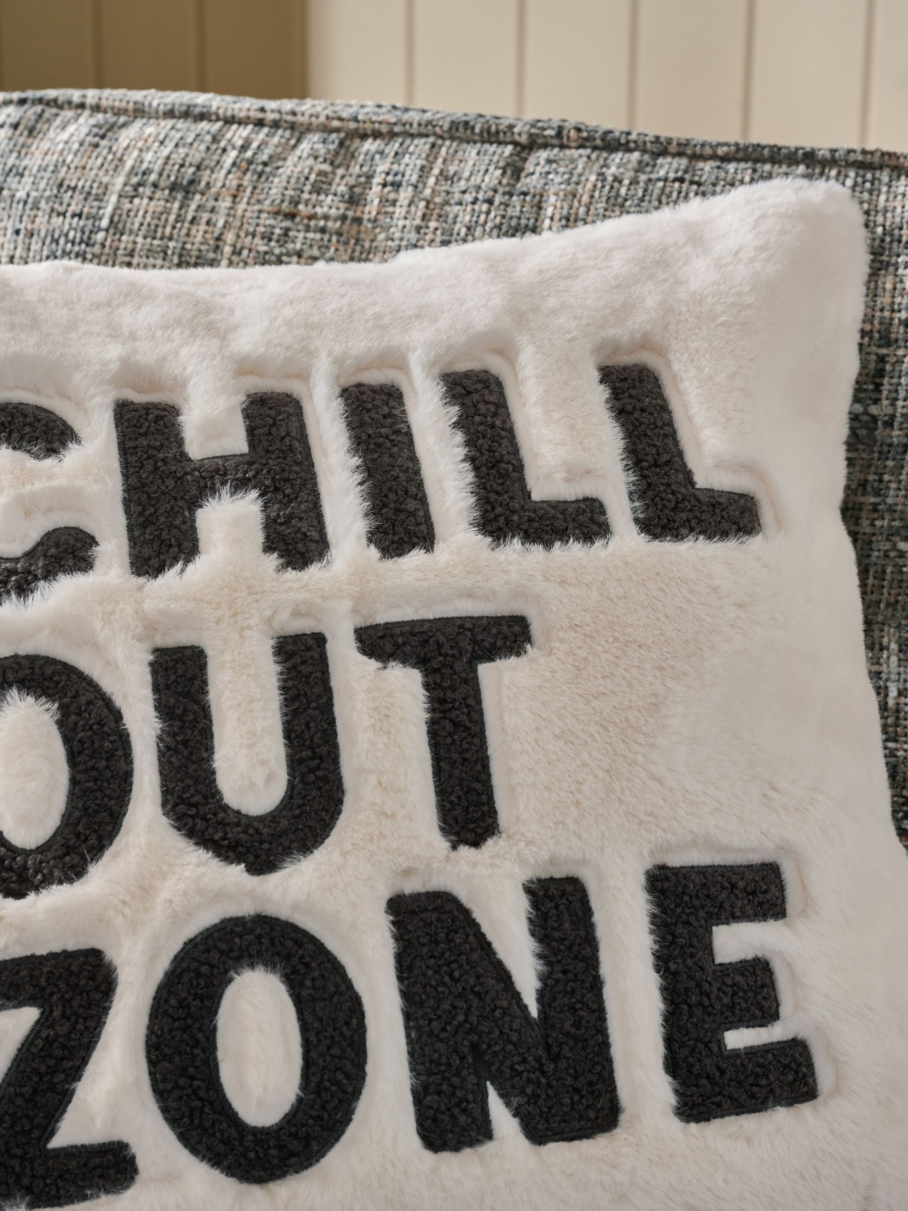 Faux fur cushion with Chill Out Zone slogan 50x50cm, imported from the UK