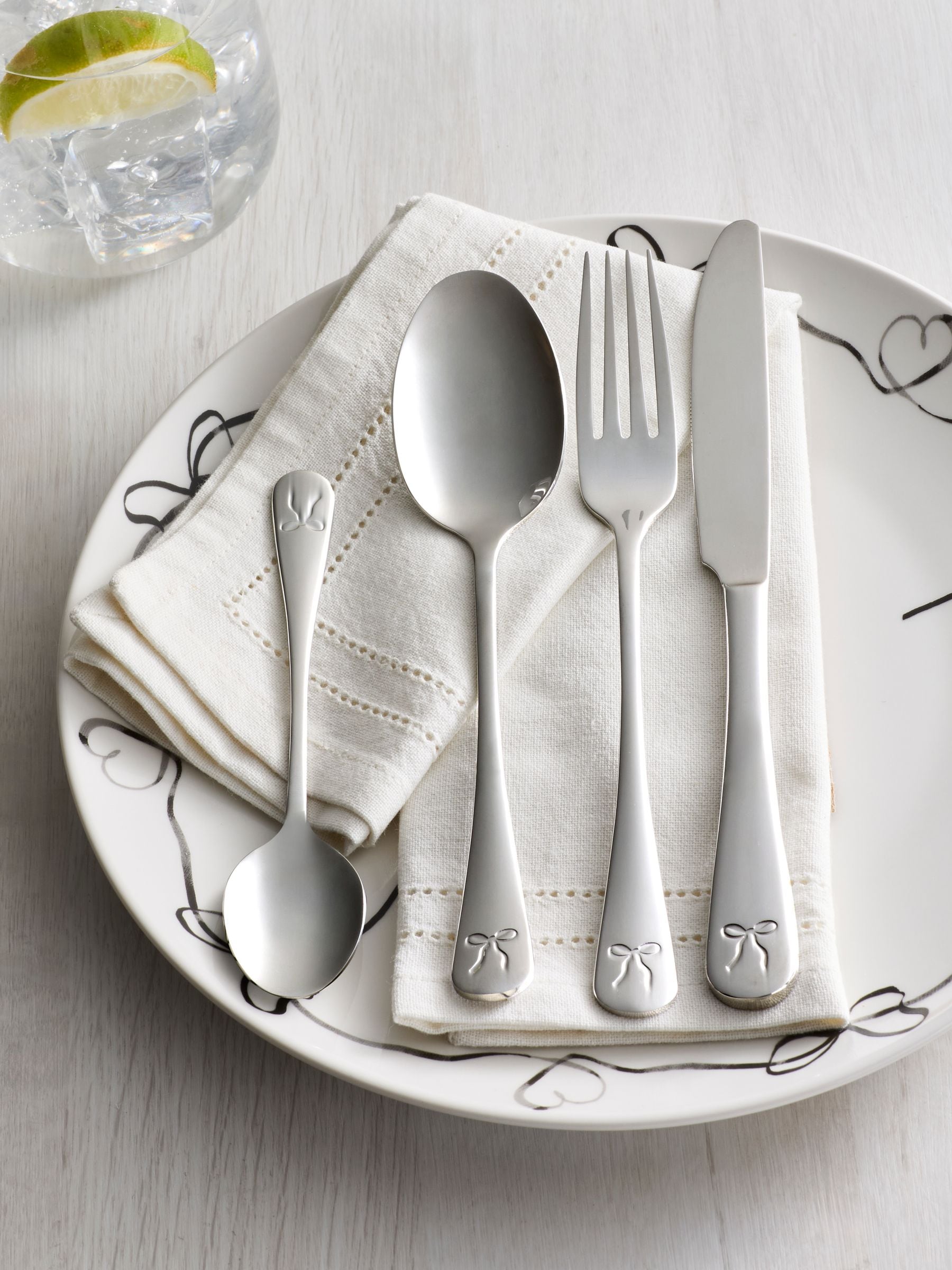 Silver bow cutlery set 16 piece, imported from the UK