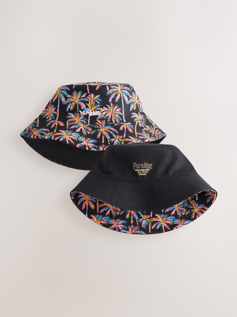 Black reversible bucket hat with palm tree print, British brand