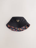 Black reversible bucket hat with palm tree print, British brand