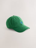 Green cap with red embroidery, imported from the UK