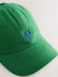 Green cap with red embroidery, imported from the UK
