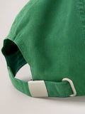 Green cap with red embroidery, imported from the UK